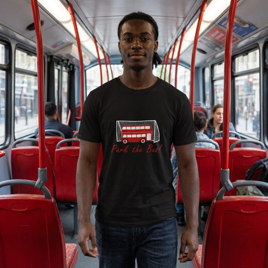 Man on a red bus wearing the black Park the Bus t-shirt showing a double-decker parked in a goal