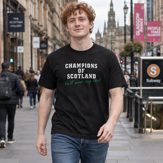 Man on a Glasgow street wearing the black Champions of Scotland t-shirt with white lettering and green script