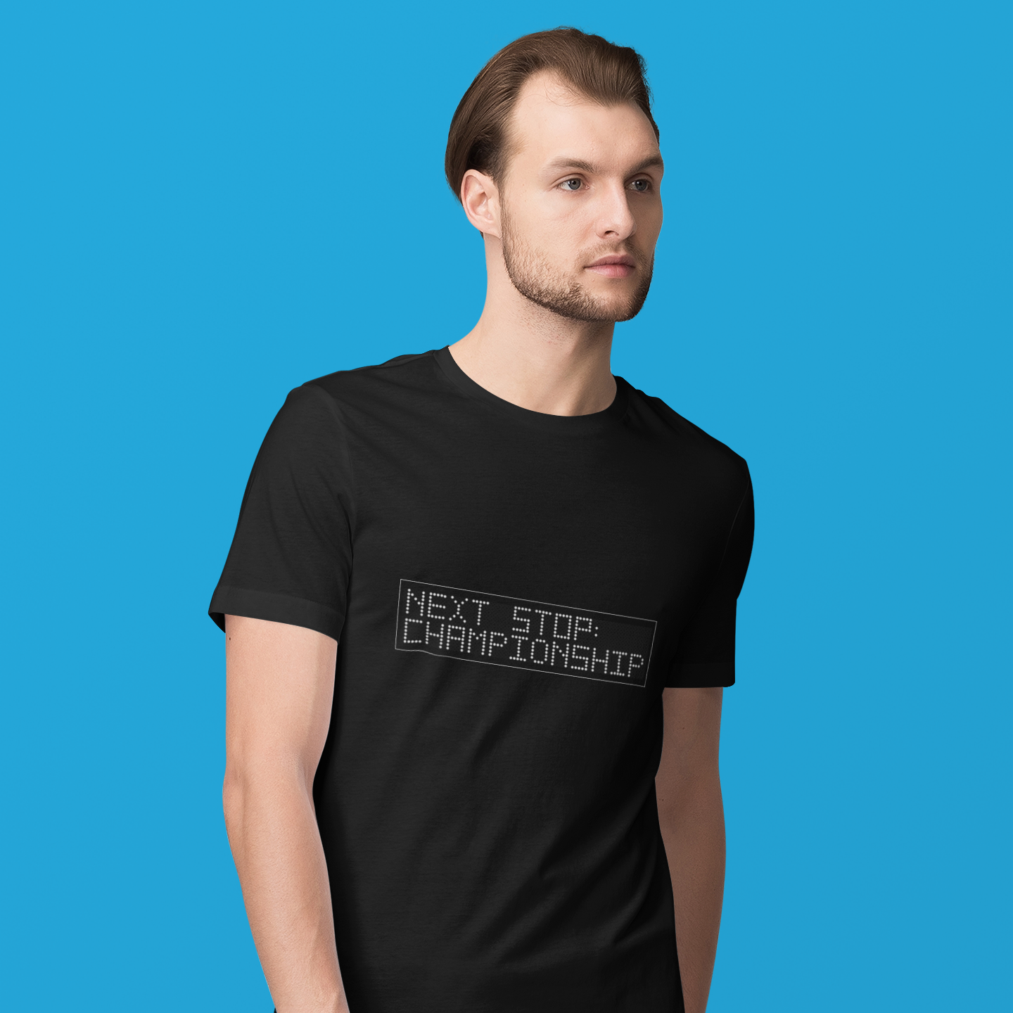 Man wearing a black t-shirt with 'Next Stop Championship' text on a blue background