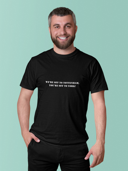 Man wearing a black short sleeve t-shirt with text that says we're off to Tottenham you're off to York on a light green background