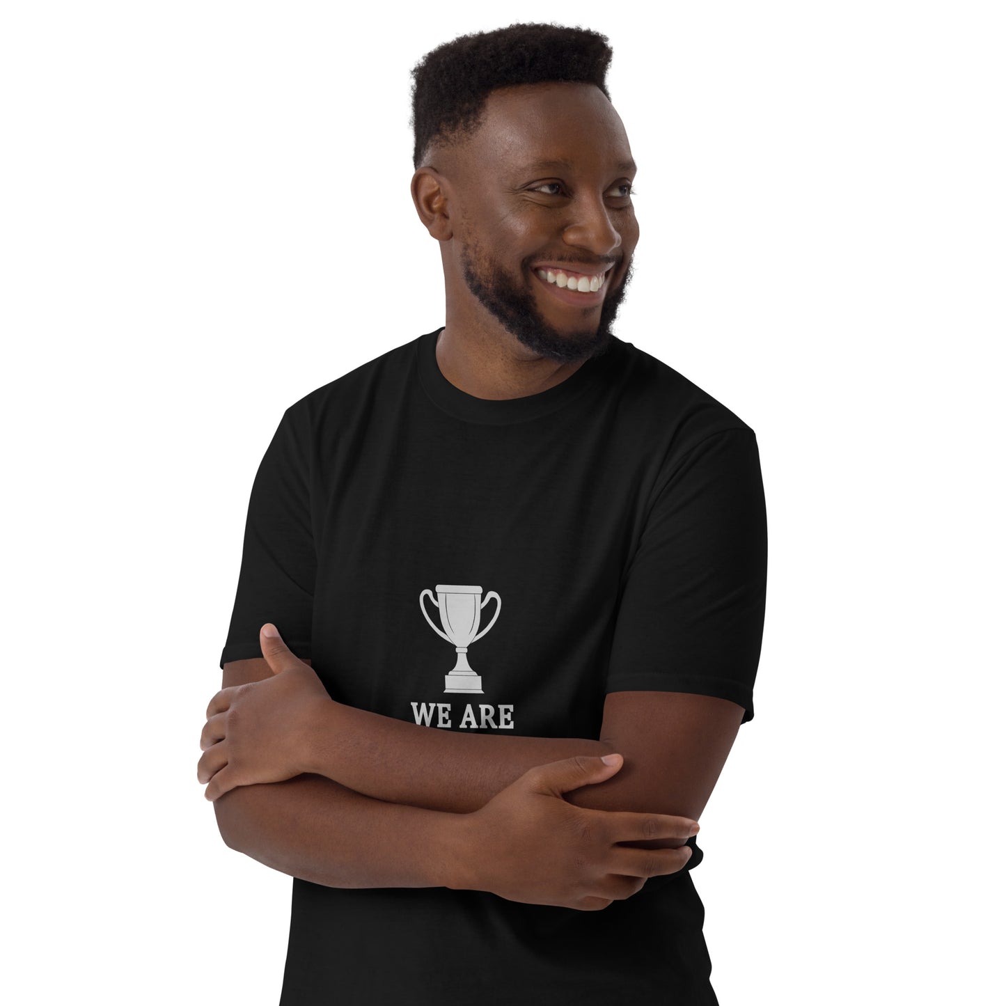 Man wearing a black short sleeve T-shirt with a trophy graphic and 'WE ARE THE CHAMPIONS' text on a white background