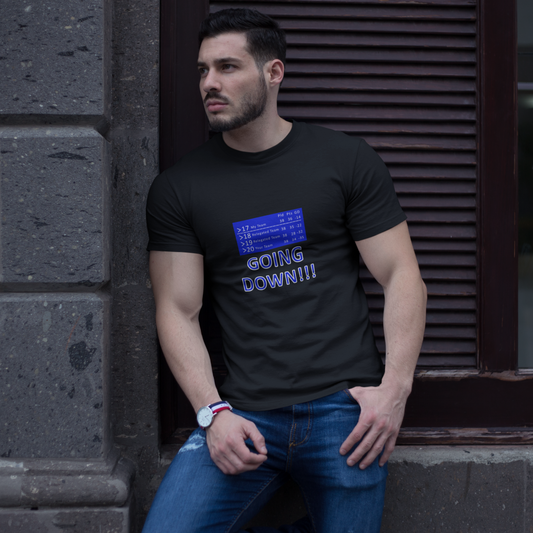 Man wearing a black t-shirt with text saying going down with a football league table leaning against a wall.